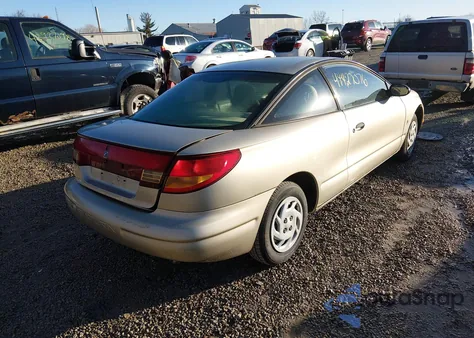1999 Saturn Sc1 z USA, uszkodzony, nr VIN 1G8ZP1289XZ366065